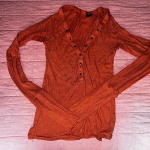 Out from under henley shirt